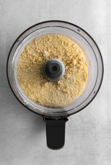 a food processor filled with flour.