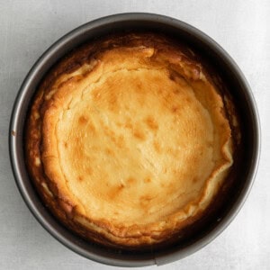 a cheesecake in a pan on a white background.