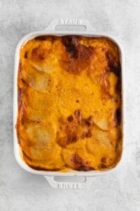 Scalloped potatoes with crispy baked cheese on the top.