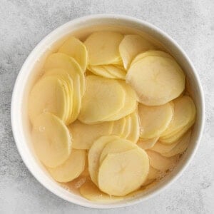 Sliced potatoes in a bowl.