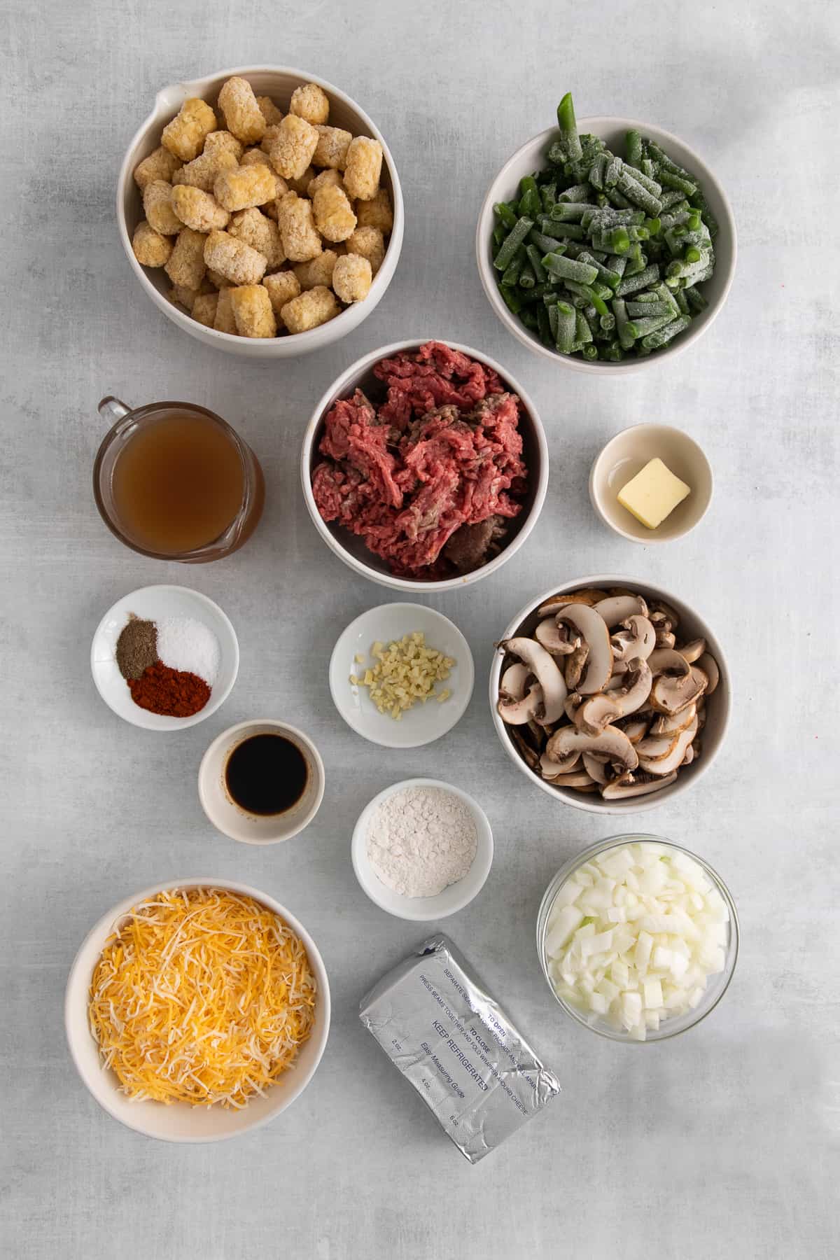 Ingredients for tater tot hot dish in bowls.