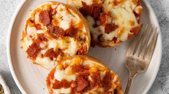 Bagel pizza bites on a plate.