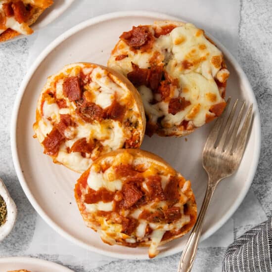 Bagel pizza bites on a plate.