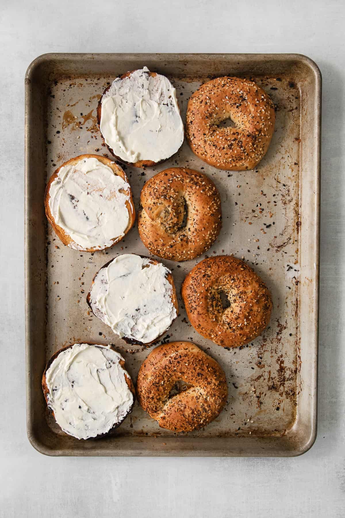 Bagels with cream cheese on them. 