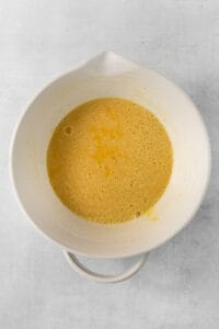 Whisked eggs in a bowl.