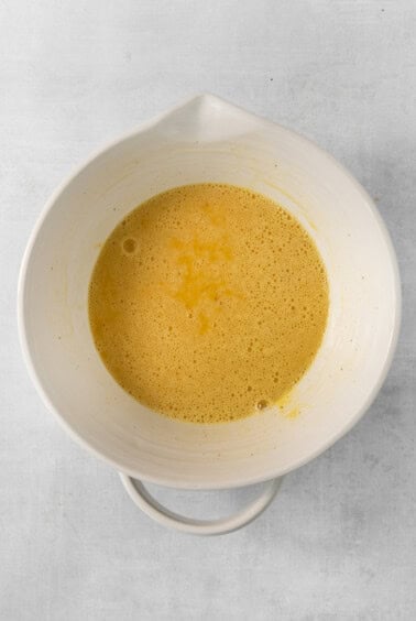 Whisked eggs in a bowl.