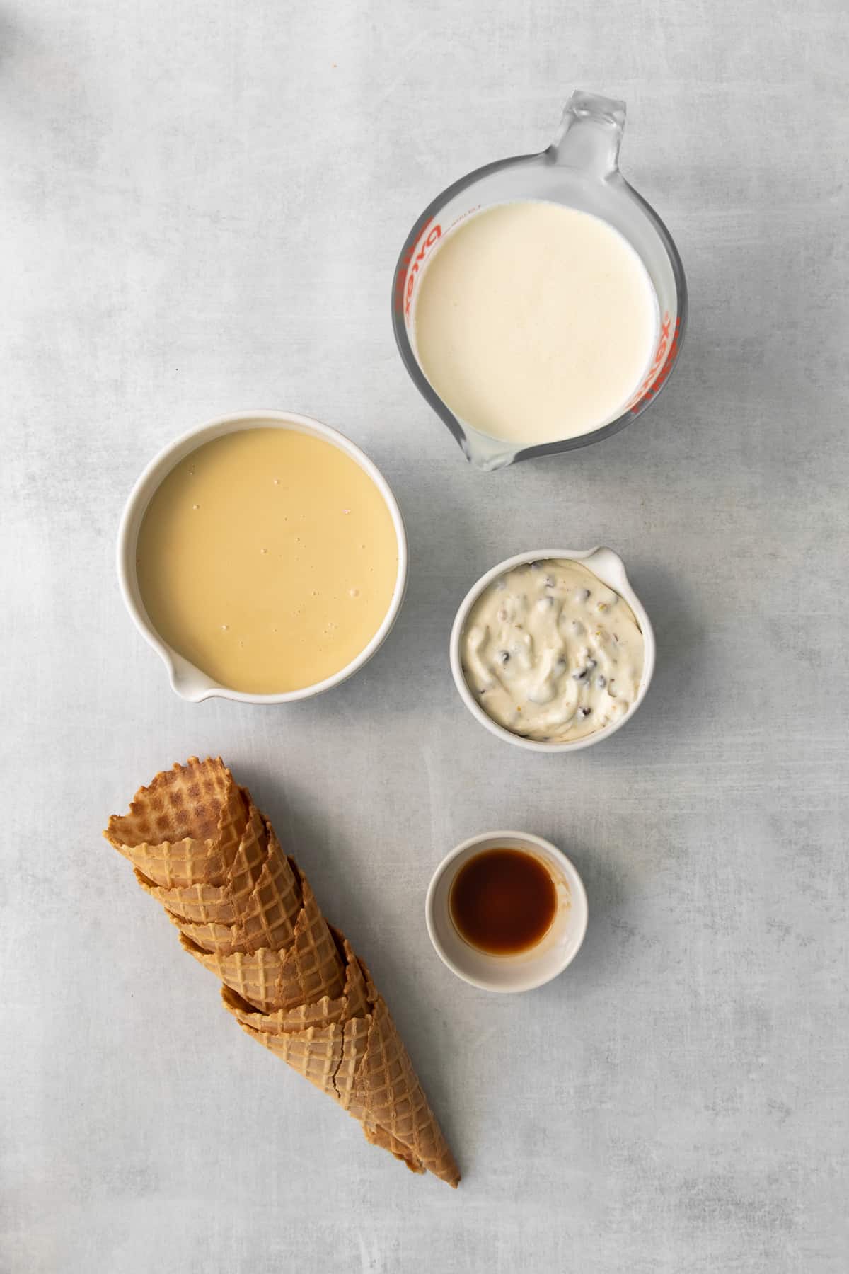 Cannoli ice cream ingredients in bowls.