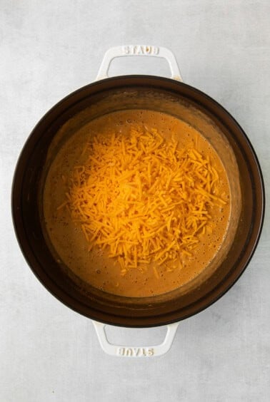 a crock pot full of cheesy nachos.