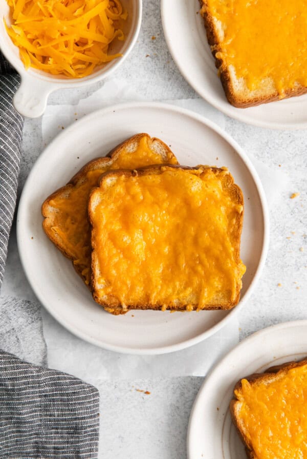 Cheese toast on a plate.