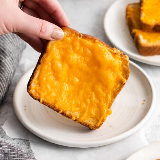 Cheese toast on a plate.