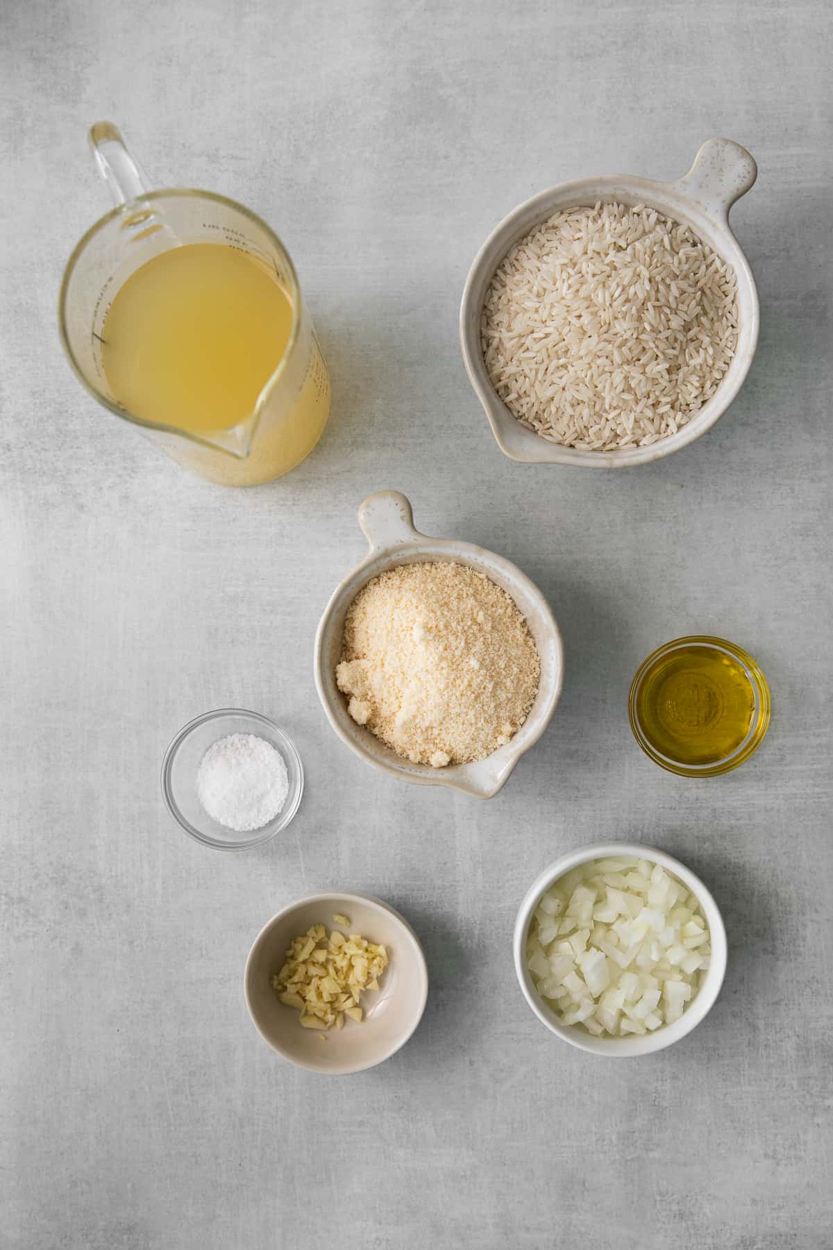 Ingredients for cheesy rice in measuring containers. 