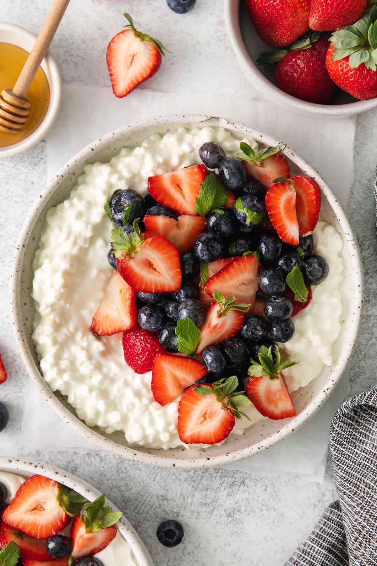 Cottage cheese breakfast bowls topped with fruit.