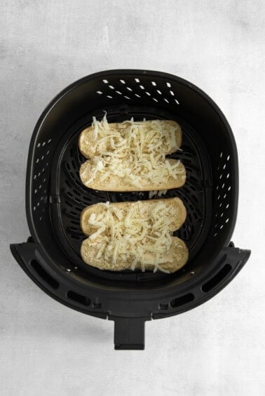 two slices of bread in an air fryer.
