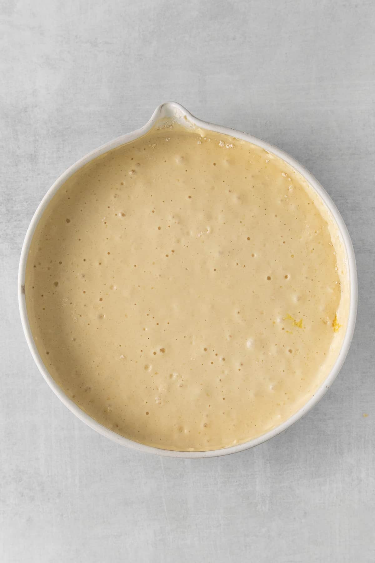 Lemon ricotta pancake batter in a bowl.