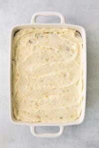 mashed potatoes in a square baking dish.