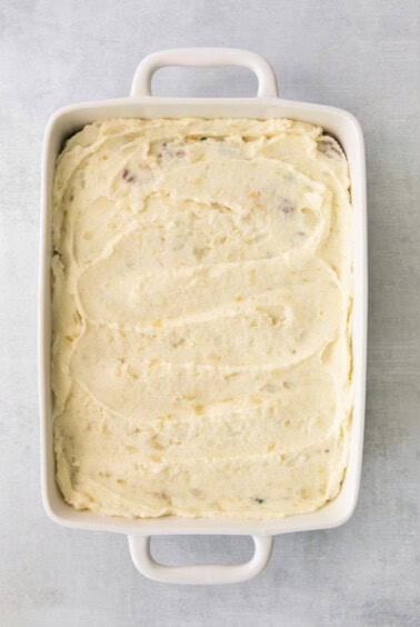 mashed potatoes in a square baking dish.