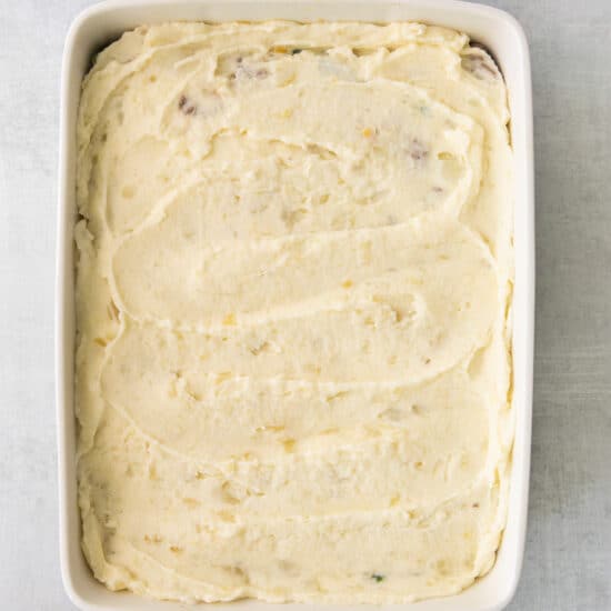 mashed potatoes in a square baking dish.