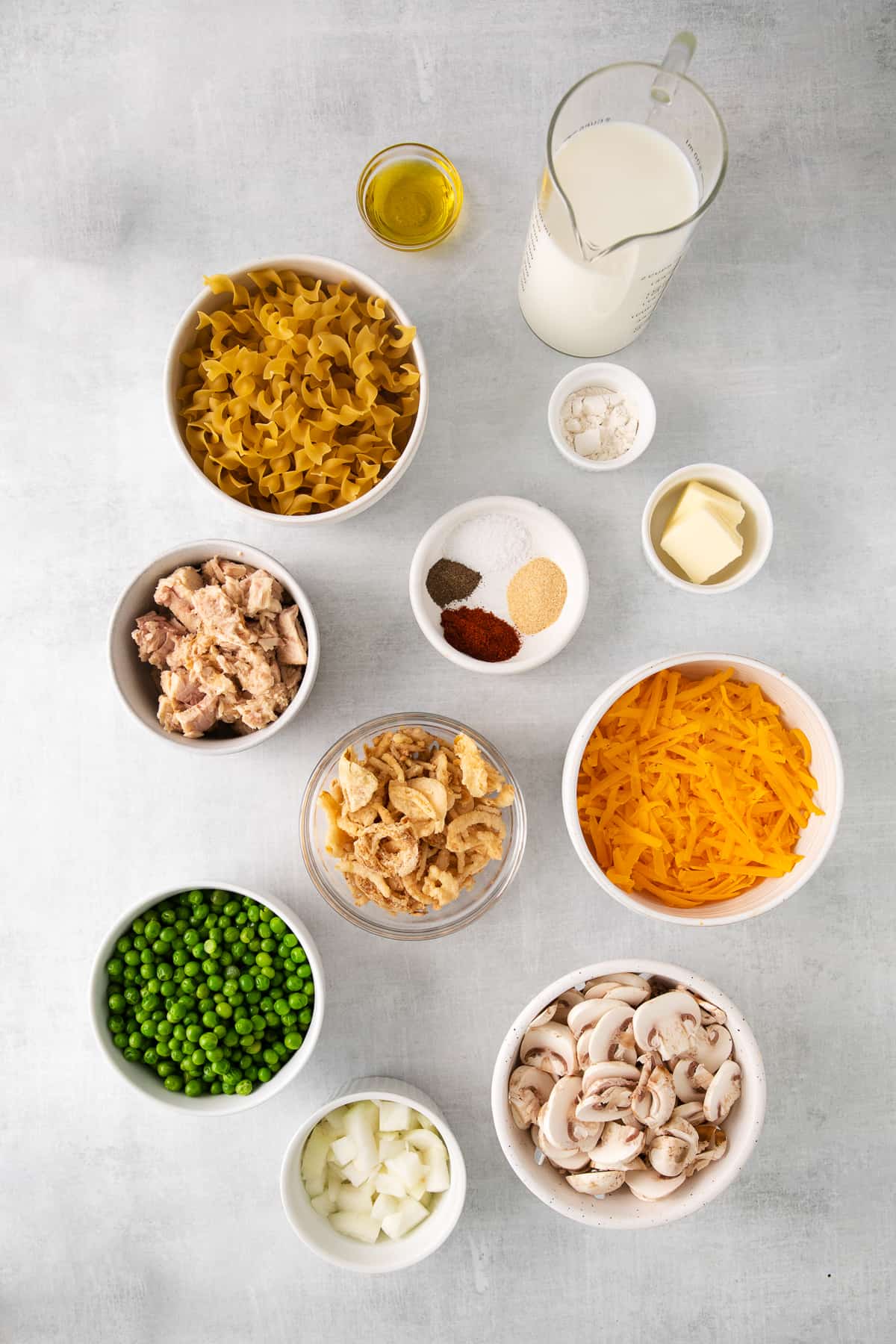 Ingredients for tuna noodle casserole in bowls.
