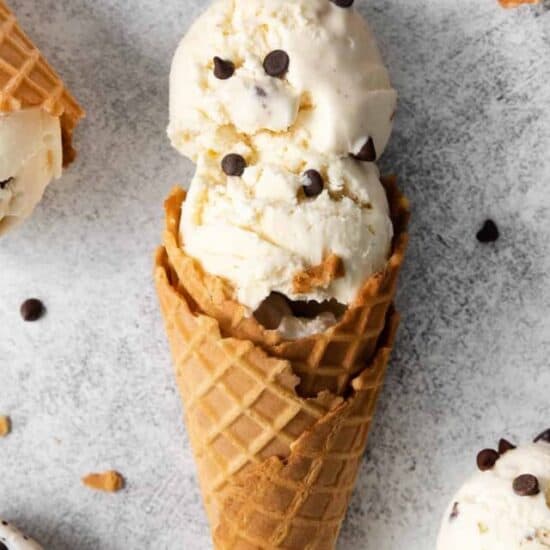 three scoops of ice cream with chocolate chips on top.