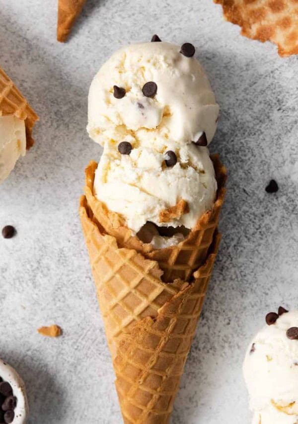three scoops of ice cream with chocolate chips on top.