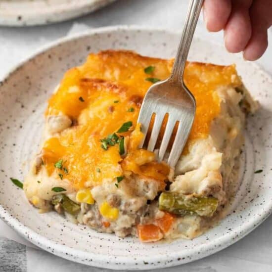 Cheesy shepherd's pie on a plate.