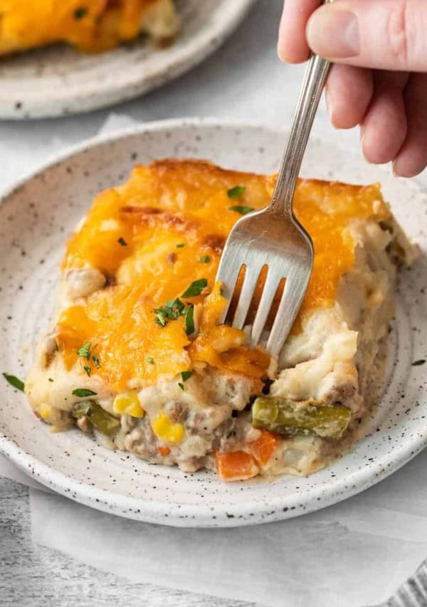 Cheesy shepherd's pie on a plate.