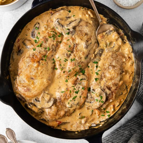 A cream cheese skillet with chicken and mushrooms in a creamy sauce.