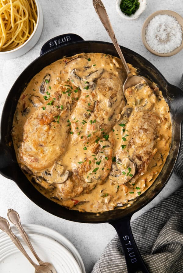 A cream cheese skillet with chicken and mushrooms in a creamy sauce.