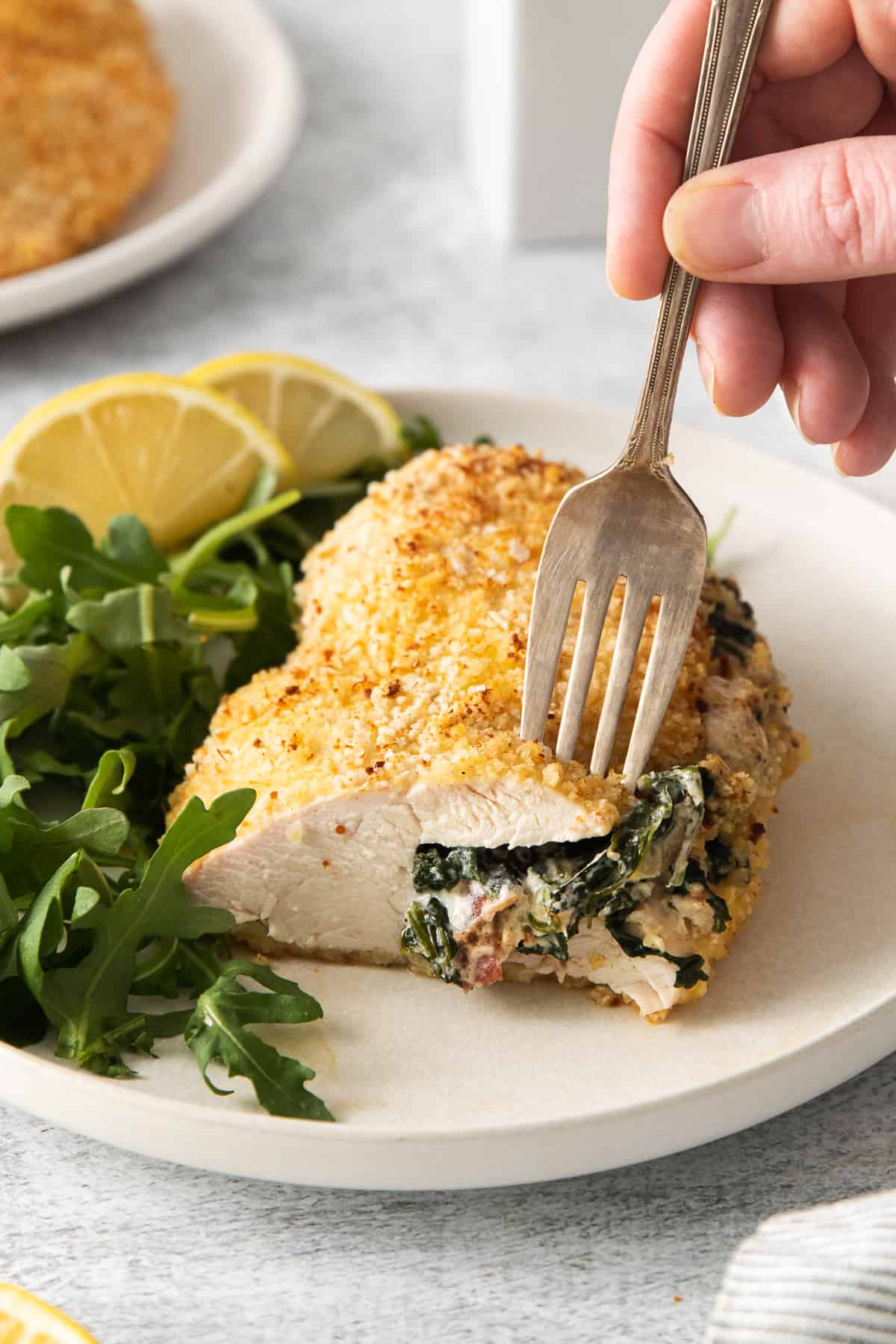 Cream cheese stuffed chicken breast on a fork.