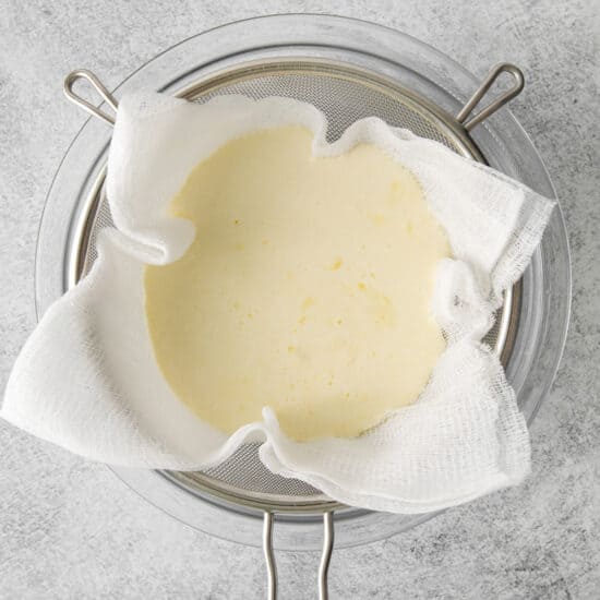 melted butter in a pan on a gray background.