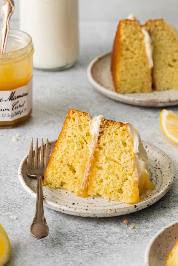 Slice of limoncello mascarpone cake on a plate.