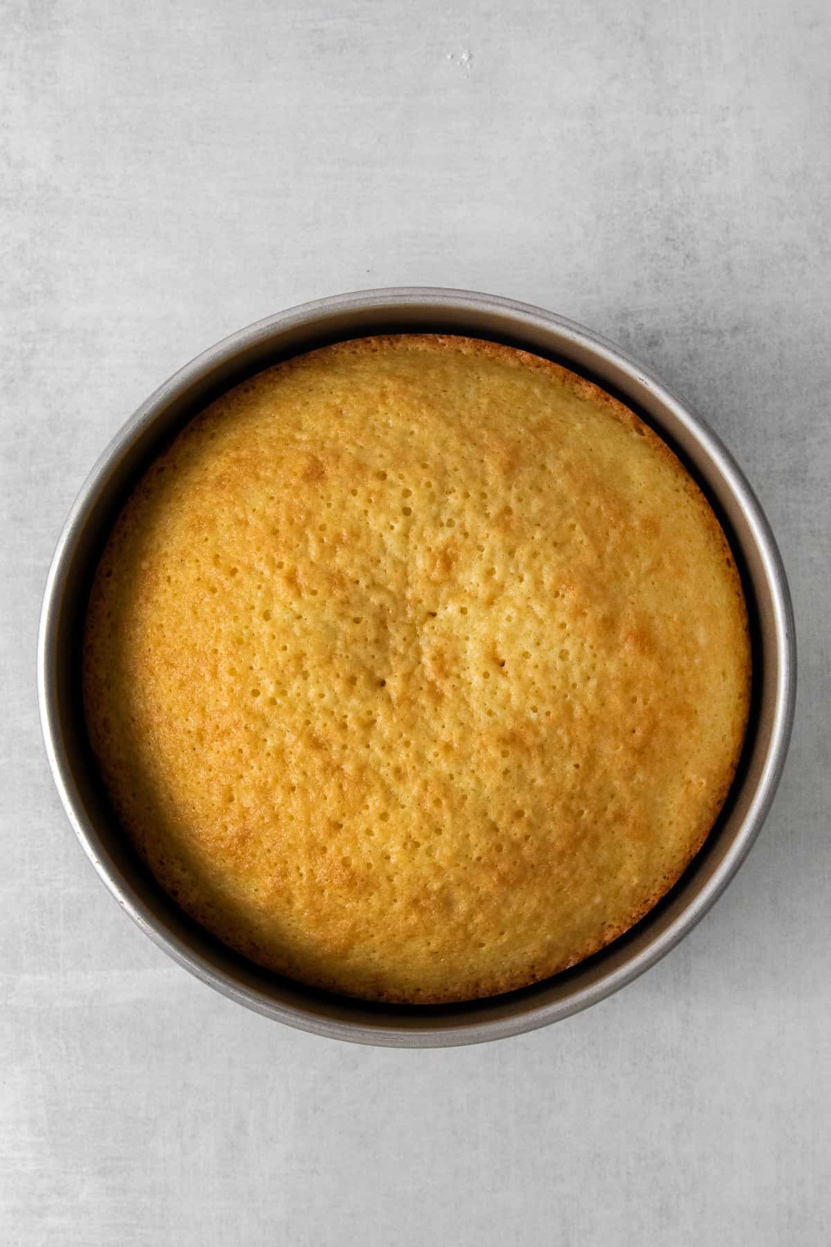 Limoncello mascarpone cake in a cake pan.