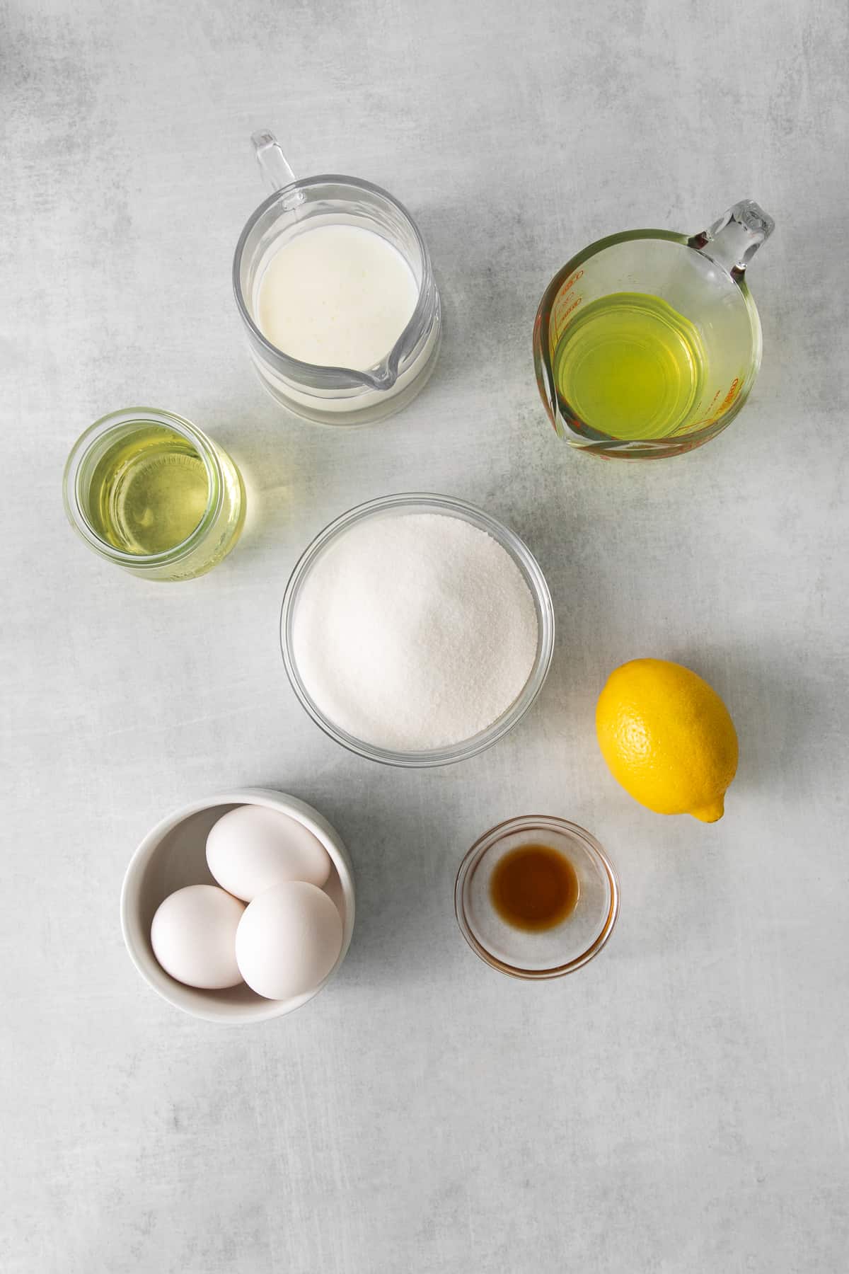 Ingredients for limoncello mascarpone cake in bowls.