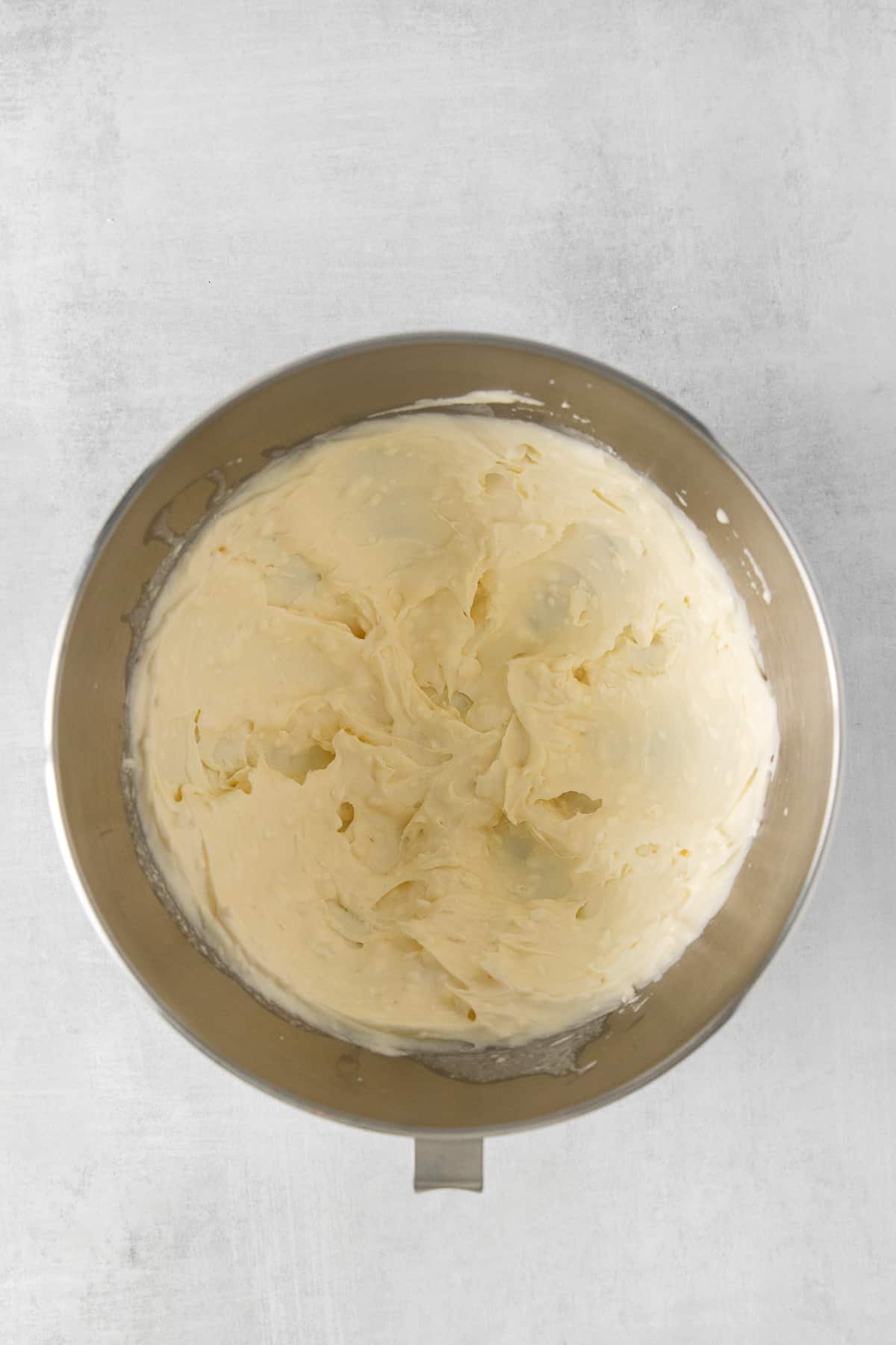 Mascarpone frosting in a mixing bowl.