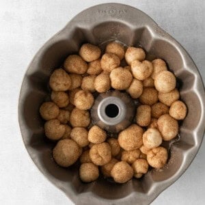 a metal bundt pan filled with doughnuts.