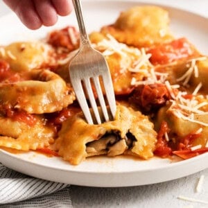 Mushroom ravioli on a plate.