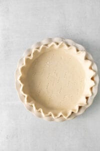 a pie crust is shown on a white background.