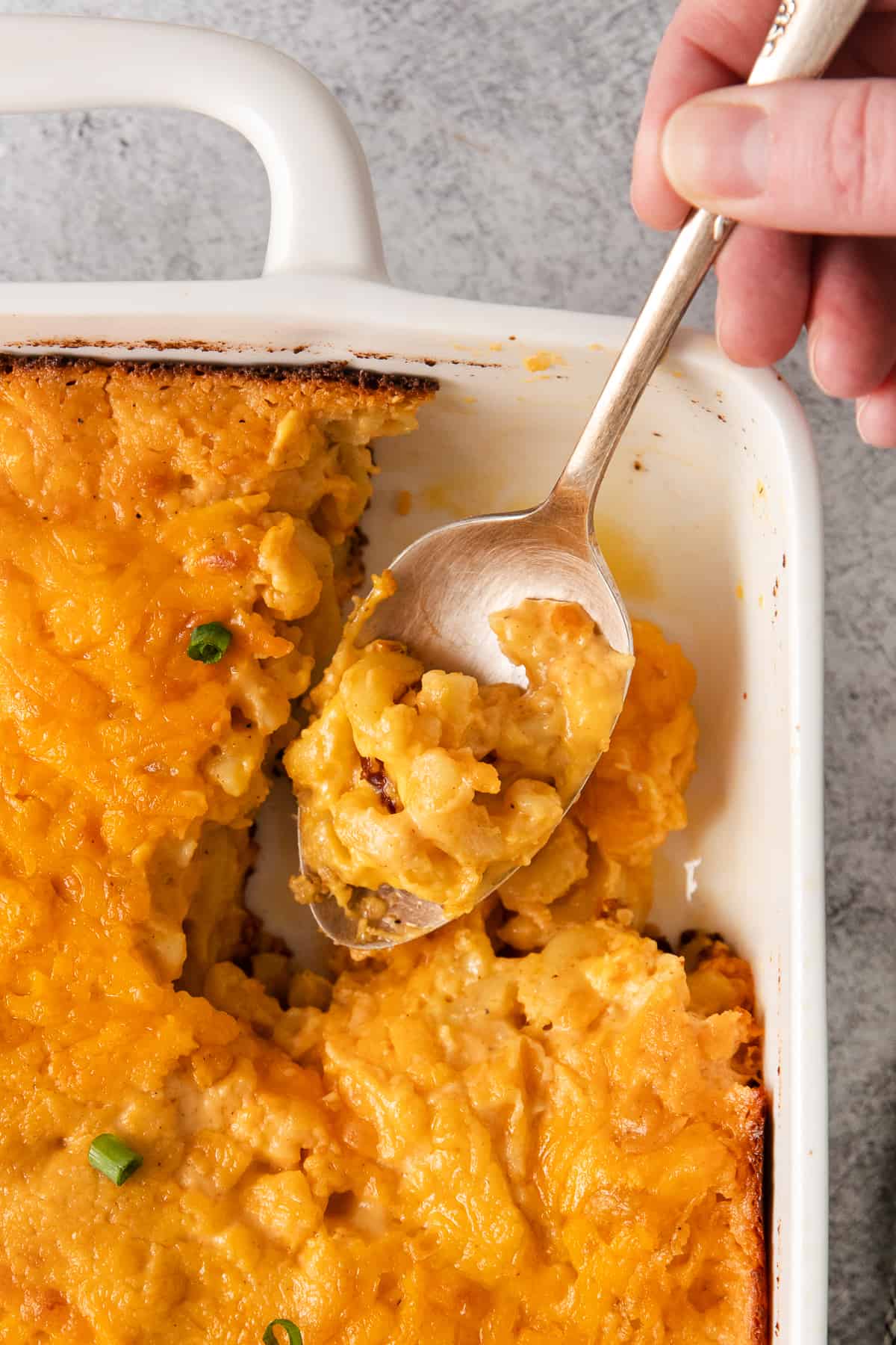 Southern baked mac and cheese on a spoon.