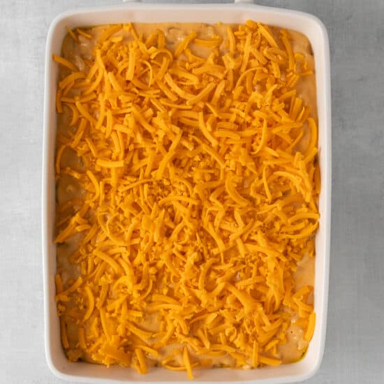 cheesy casserole in a square dish.