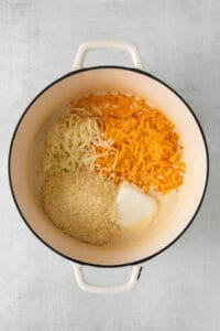 a pot filled with cheese and other ingredients.