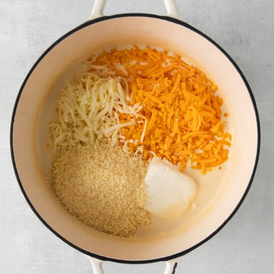 a pot filled with cheese and other ingredients.