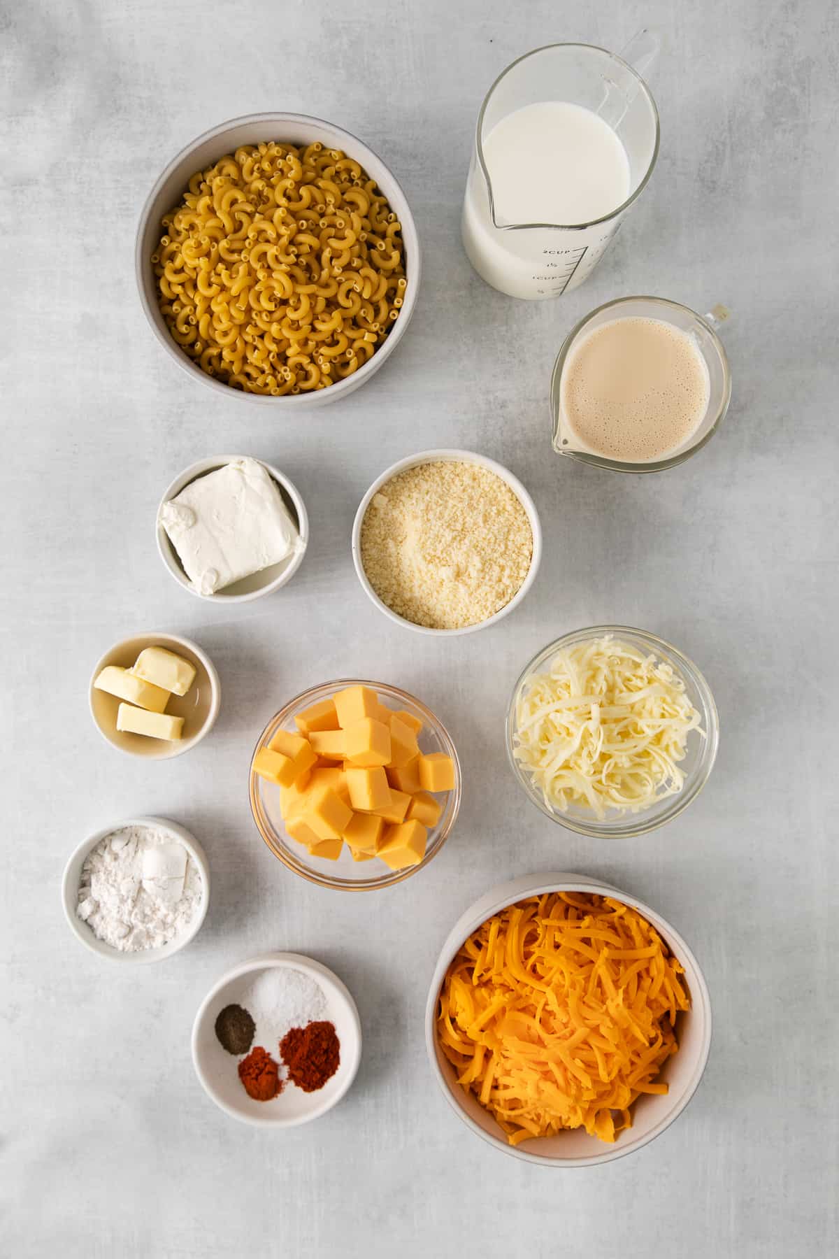 Ingredients for southern baked mac and cheese in bowls.