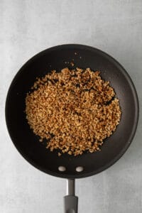 a frying pan with granola in it.