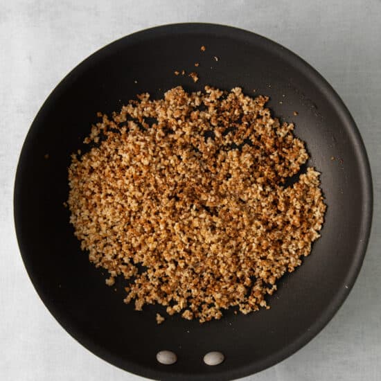 a frying pan with granola in it.