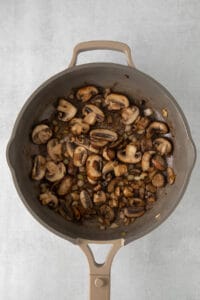 mushrooms in a skillet on a white background.