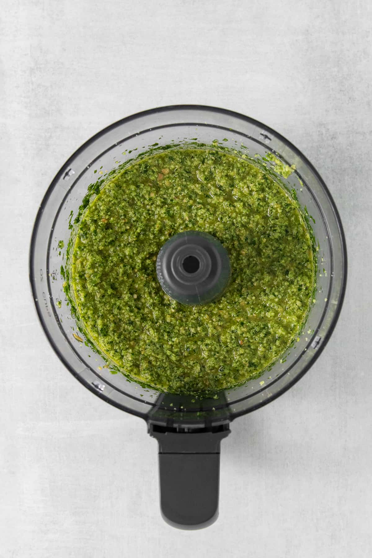 Cilantro pesto in a food processor.