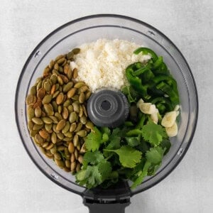 a food processor filled with various ingredients.