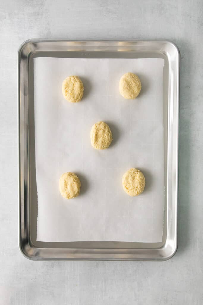 Lemon ricotta cookie dough on a cookie sheet.