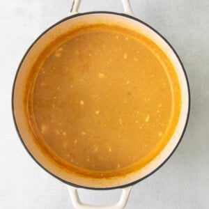 a pot of soup on a white background.