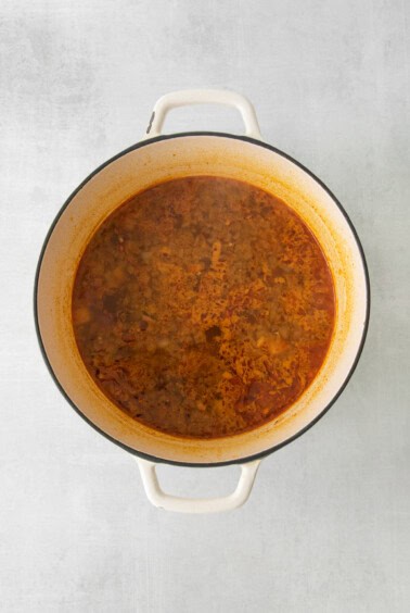a pot of stew on a white background.
